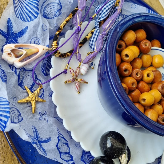 Ketting satijnkoord zeester goud