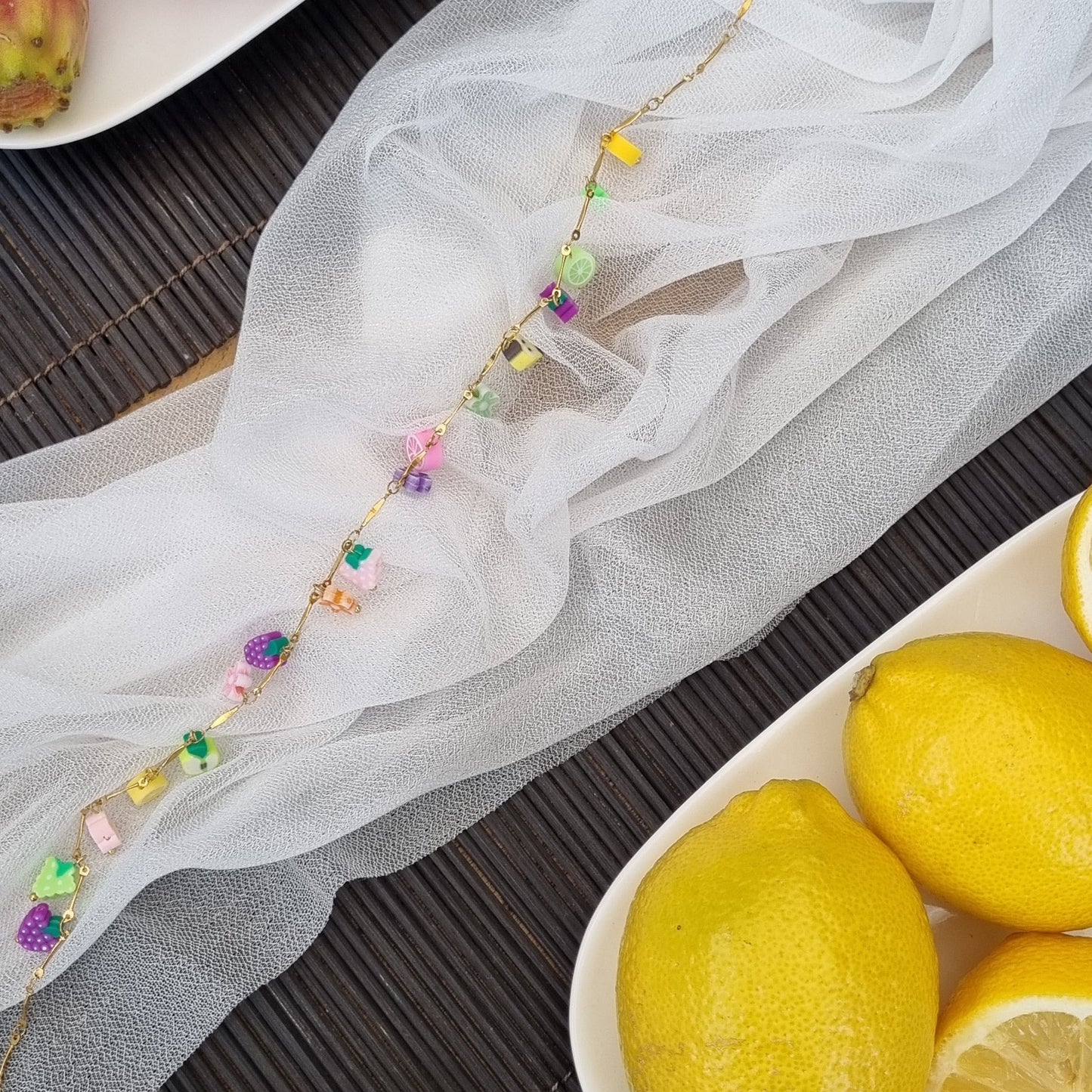 Ketting schakels fruit bloemetjes goud