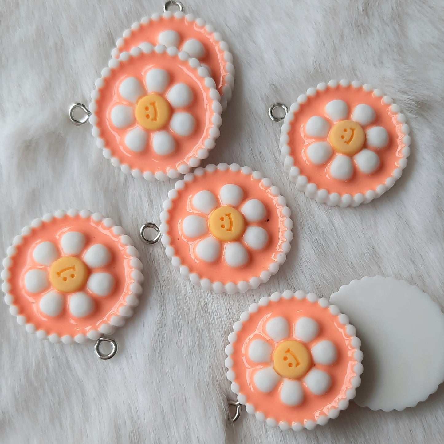 Bedel bloem rond smiley oranje