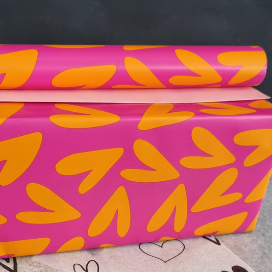 Cadeaupapier hartjes oranje roze