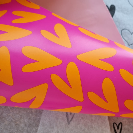 Cadeaupapier hartjes oranje roze